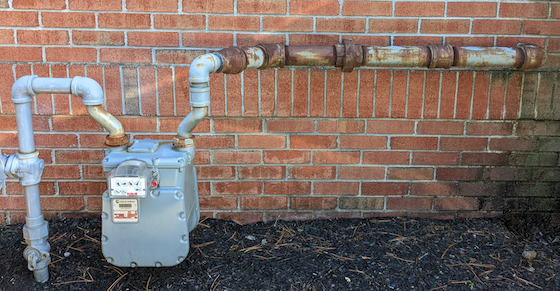 natural gas meter and rusty trunk line